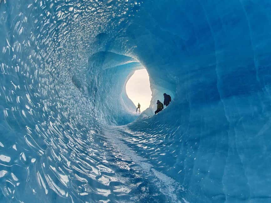 2-Day South Coast, Blue Ice Cave, Glacier Lagoon Tour - Diamond Beach and black sand beneath the ice
