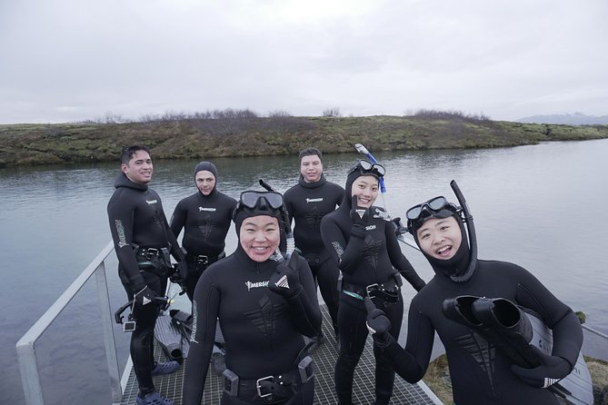 Freedive Silfra Half Day Tour - Entering Silfra with a guide beside you