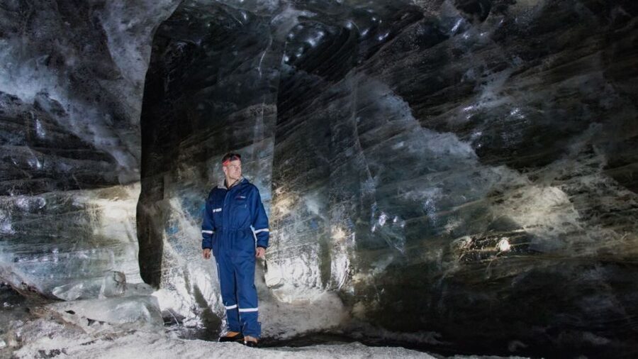 From Gullfoss: Langjökull Ice Cave and Snowmobile Tour - Getting suited up at the glacier hut
