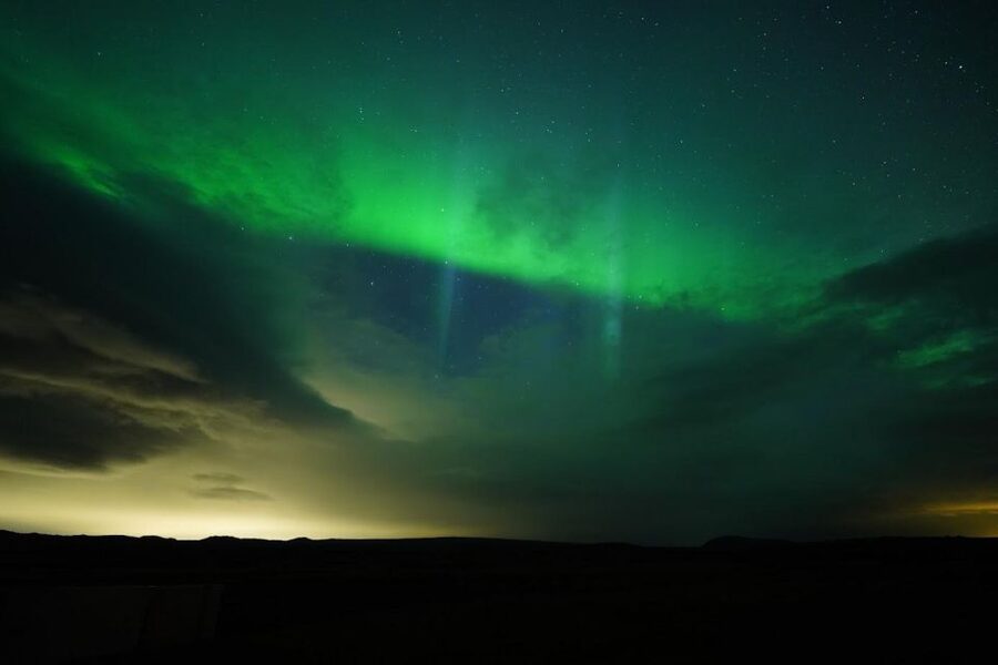 From Reykjavik: Northern Lights Tour with Hot Cocoa & Photos - The secret stop and the art of waiting