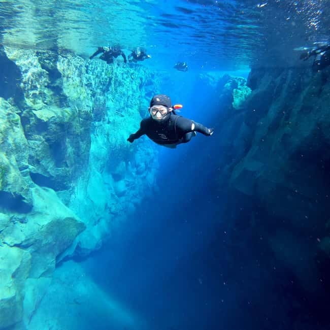 From Reykjavik: Silfra Snorkeling with Free Photos - Getting fitted for a drysuit or wetsuit