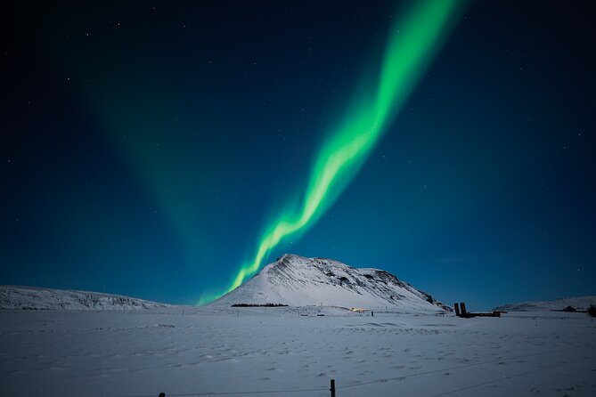Northern Lights Tour with Photos, Snacks, Warm Snowsuits, Chairs - Pickup details in central Reykjavik