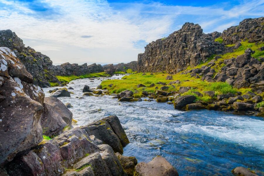 Reykjavik: Golden Circle Day Trip with Blue Lagoon Transfer - Kerid Crater: red volcanic rock and a blue-green lake