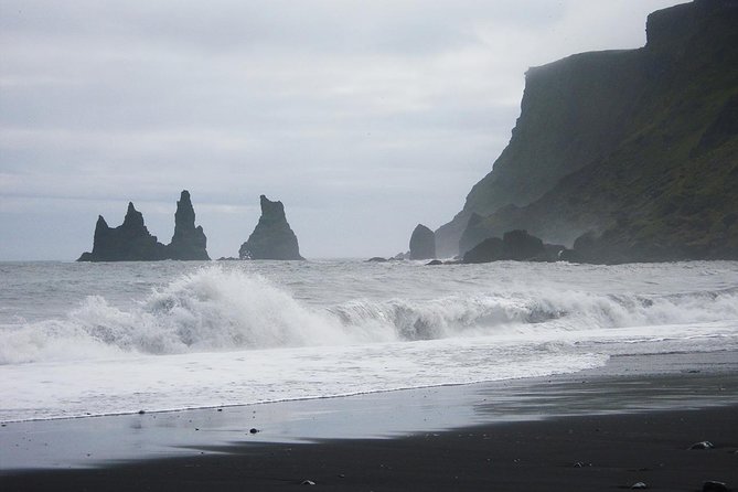 South Coast and Glacier Lagoon Day Trip by Super Jeep from Reykjavik - Dyrhólaey and Reynisfjara show Iceland’s dark coastline