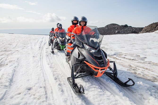 South Coast and Glacier Snowmobiling Day Trip from Reykjavik - Skógafoss: A Short Stop With Serious Force