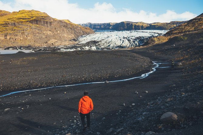 South Coast Day Tour Black Sand Beach & Waterfalls from Reykjavik - Solheimajokull Glacier at the edge of the ice