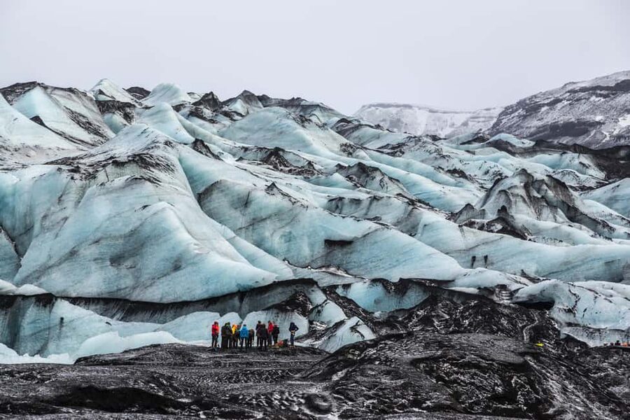 South Coast, Glacier Hike and Northern Lights Winter Tour - Seljalandsfoss and the path behind the water