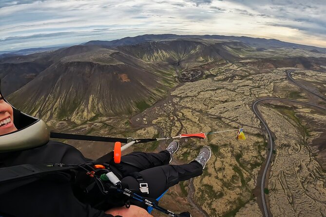 Tandem Paragliding over the Rugged Lava Fields at Blue Mountains - A calm safety briefing before the running start