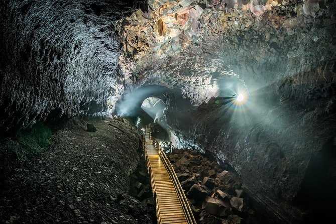 The Cave Explorer - Wooden walkways, black rock, and guided stops